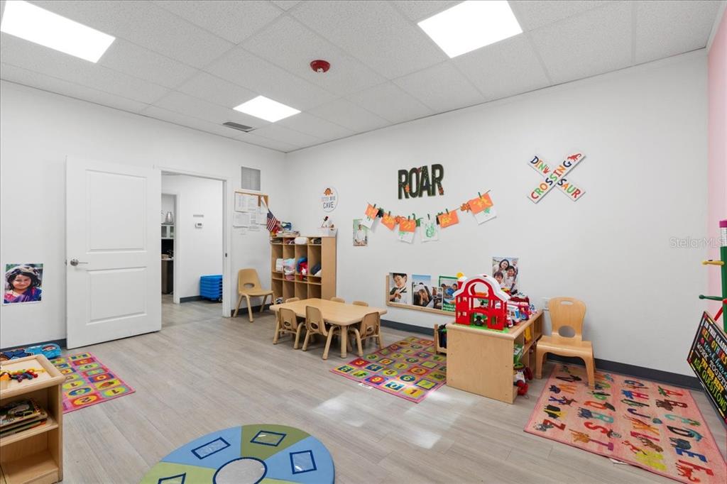 1938 Northeast Waldo Road Gainesville, FL 32609 - Photo 22 of 64 a living room with furniture and a couch
