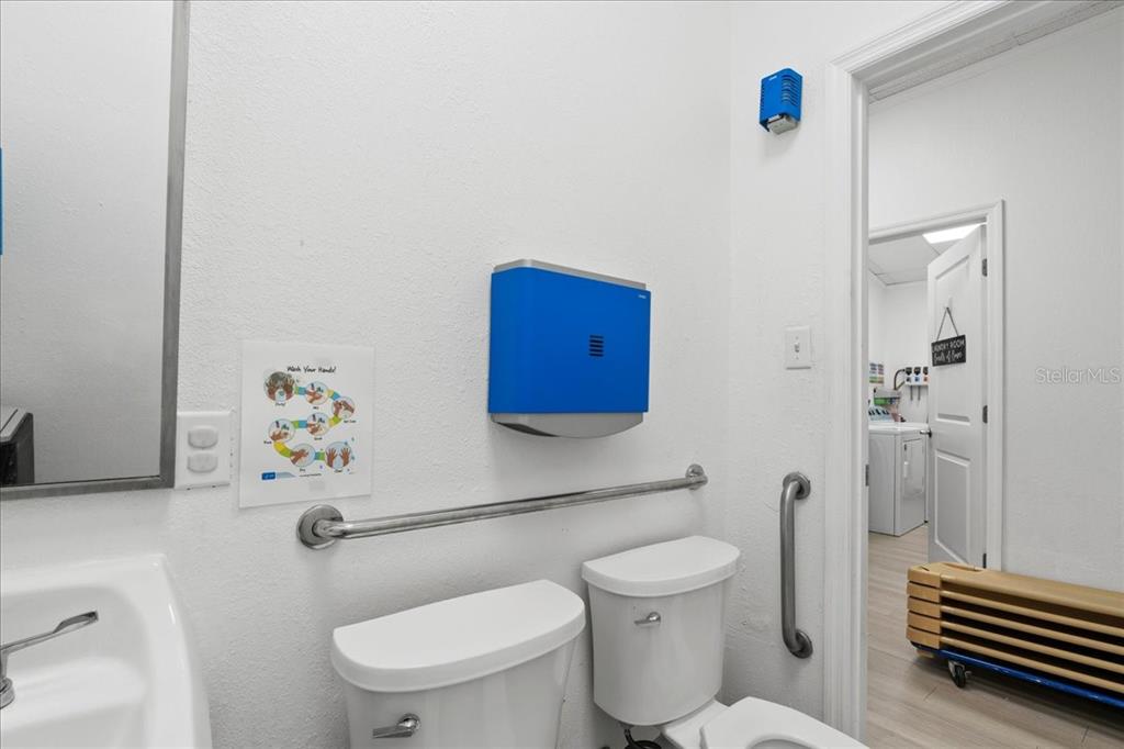 1938 Northeast Waldo Road Gainesville, FL 32609 - Photo 31 of 64 a bathroom with a toilet and a shower