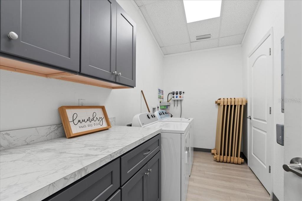 1938 Northeast Waldo Road Gainesville, FL 32609 - Photo 32 of 64 a kitchen with stainless steel appliances granite countertop a sink a stove and dishwasher