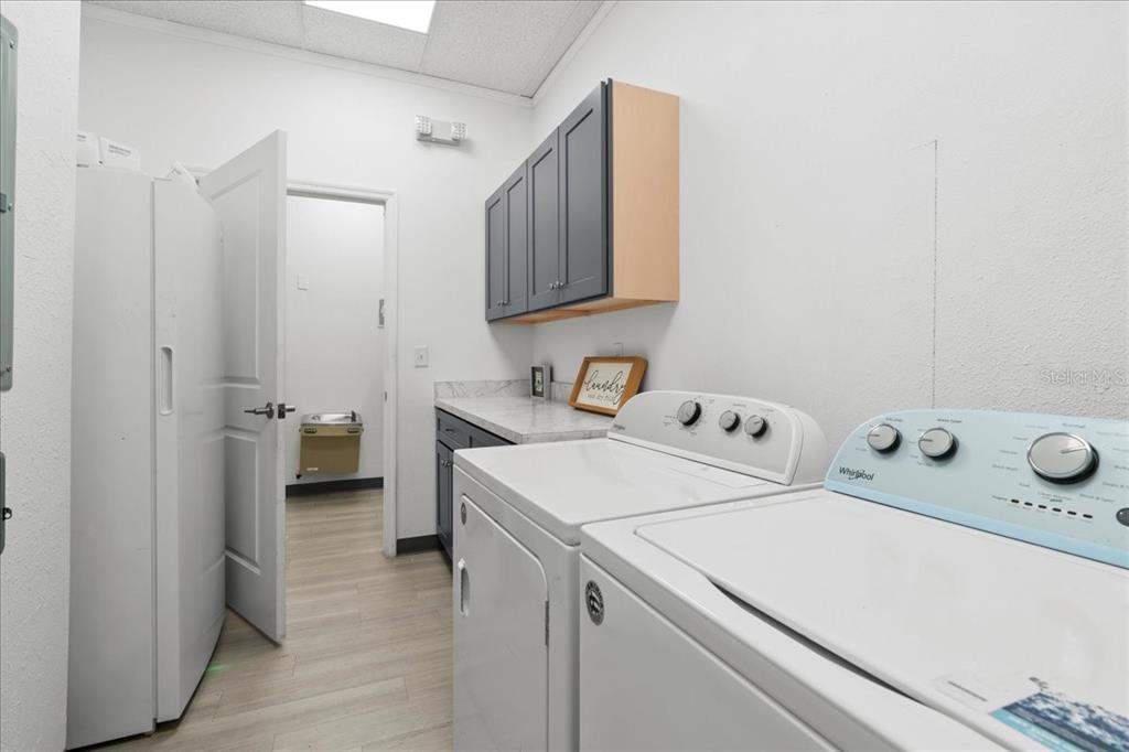 1938 Northeast Waldo Road Gainesville, FL 32609 - Photo 33 of 64 a utility room with dryer and washer
