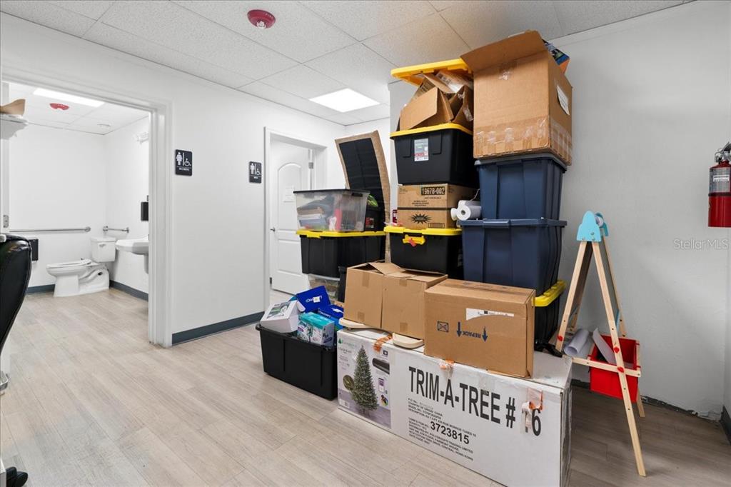 1938 Northeast Waldo Road Gainesville, FL 32609 - Photo 36 of 64 a living room with a couch and a wooden floor