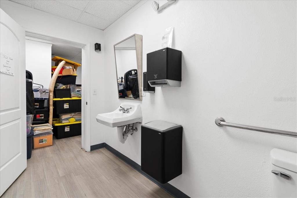 1938 Northeast Waldo Road Gainesville, FL 32609 - Photo 40 of 64 a view of walk in closet with clothes and shoes
