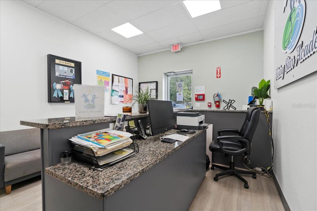 1938 Northeast Waldo Road Gainesville, FL 32609 - Photo 4 of 64 a living room with furniture and a rug