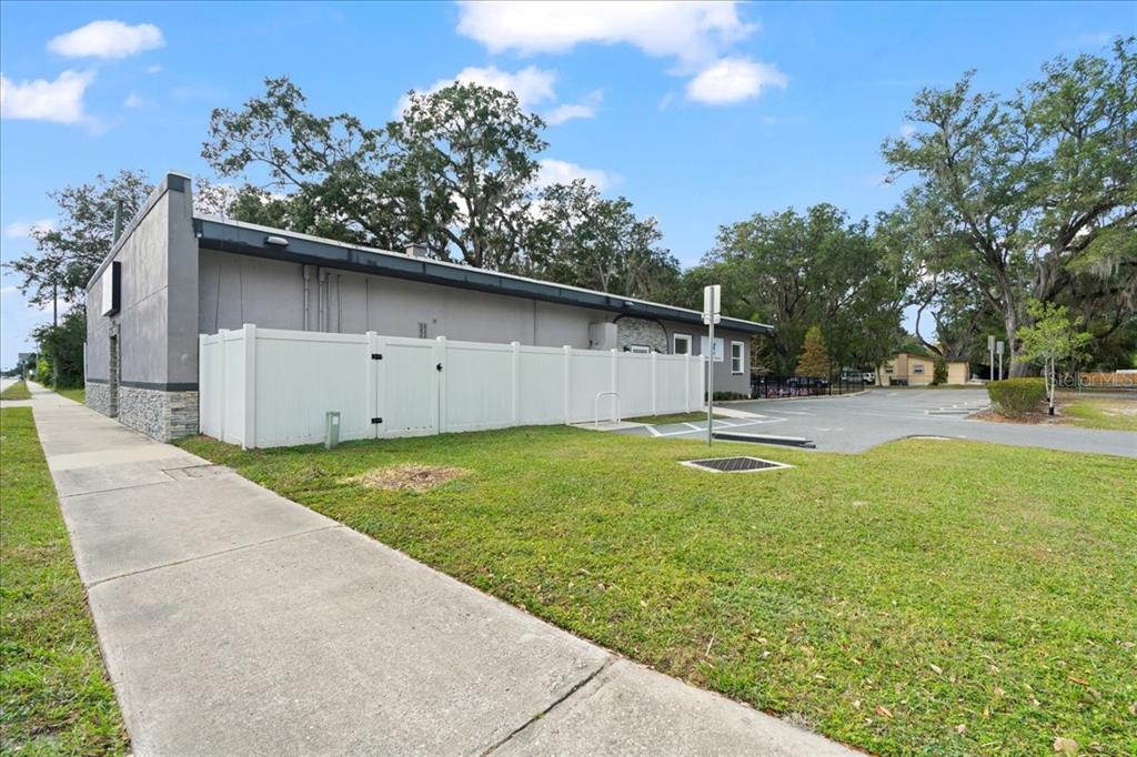 1938 Northeast Waldo Road Gainesville, FL 32609 - Photo 43 of 64 a backyard of a house with table and chairs