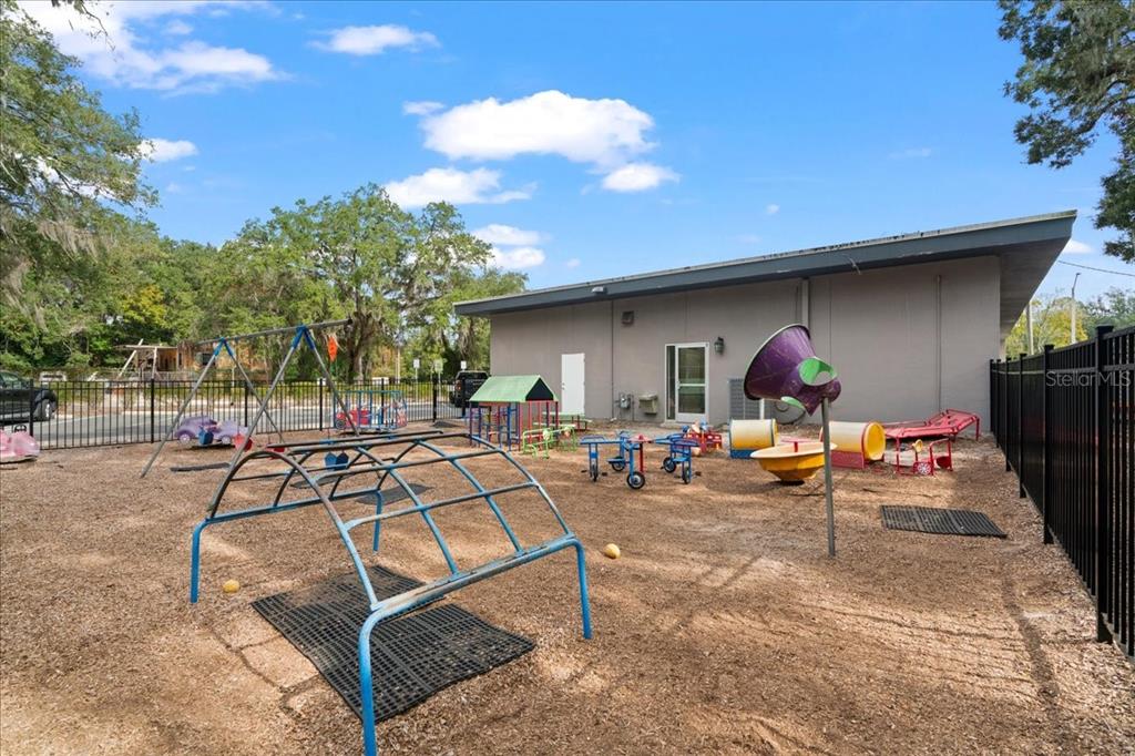 1938 Northeast Waldo Road Gainesville, FL 32609 - Photo 47 of 64 a view of a backyard tables and chairs