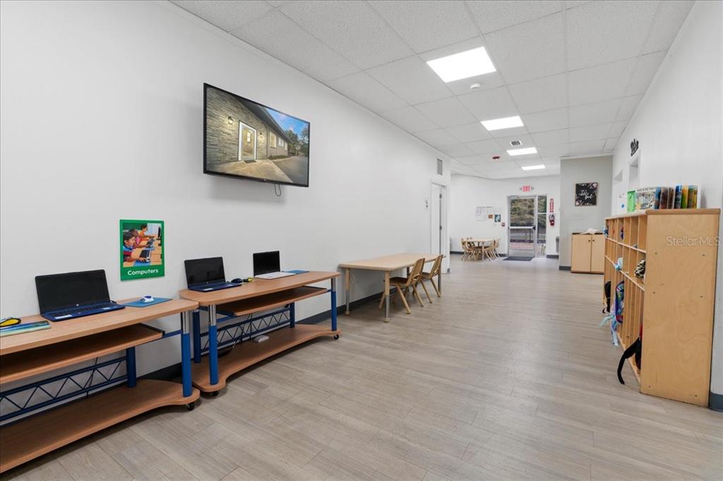 1938 Northeast Waldo Road Gainesville, FL 32609 - Photo 5 of 64 a view of a livingroom with furniture and a flat screen tv