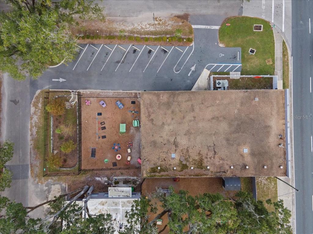 1938 Northeast Waldo Road Gainesville, FL 32609 - Photo 55 of 64 an aerial view of a house with a yard