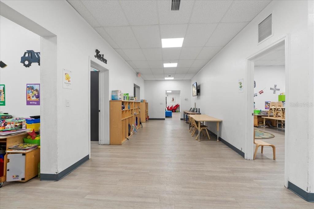 1938 Northeast Waldo Road Gainesville, FL 32609 - Photo 6 of 64 a living room with furniture and a wooden floor