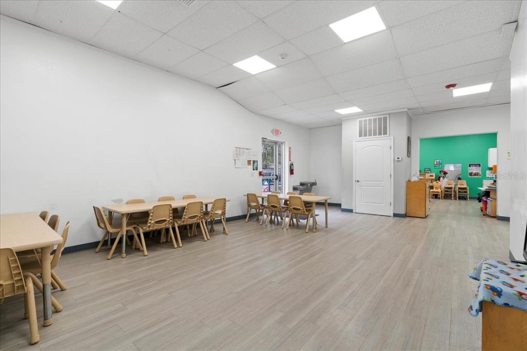 1938 Northeast Waldo Road Gainesville, FL 32609 - Photo 8 of 64 a view of a dining room with furniture and wooden floor