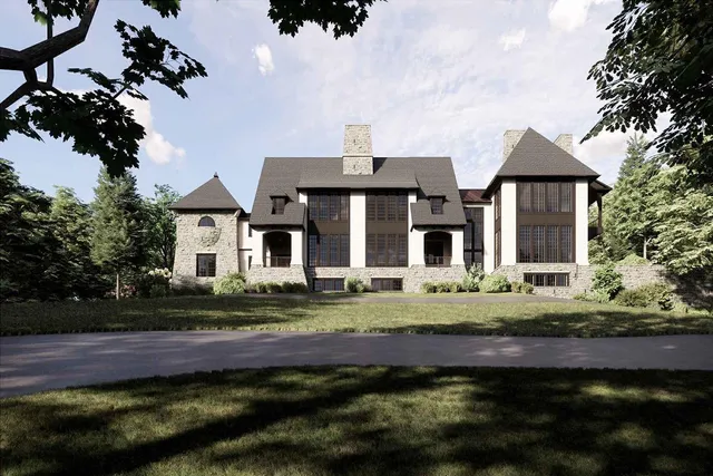 a front view of a house with a garden and pathway