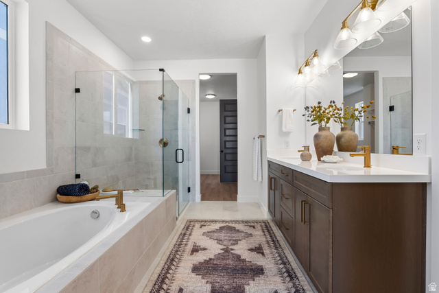 624 North Legend Circle, Unit 480 Mapleton, UT 84664 - Photo 26 of 34 Full bath featuring double vanity, a stall shower, a garden tub, and healthy amount of natural light