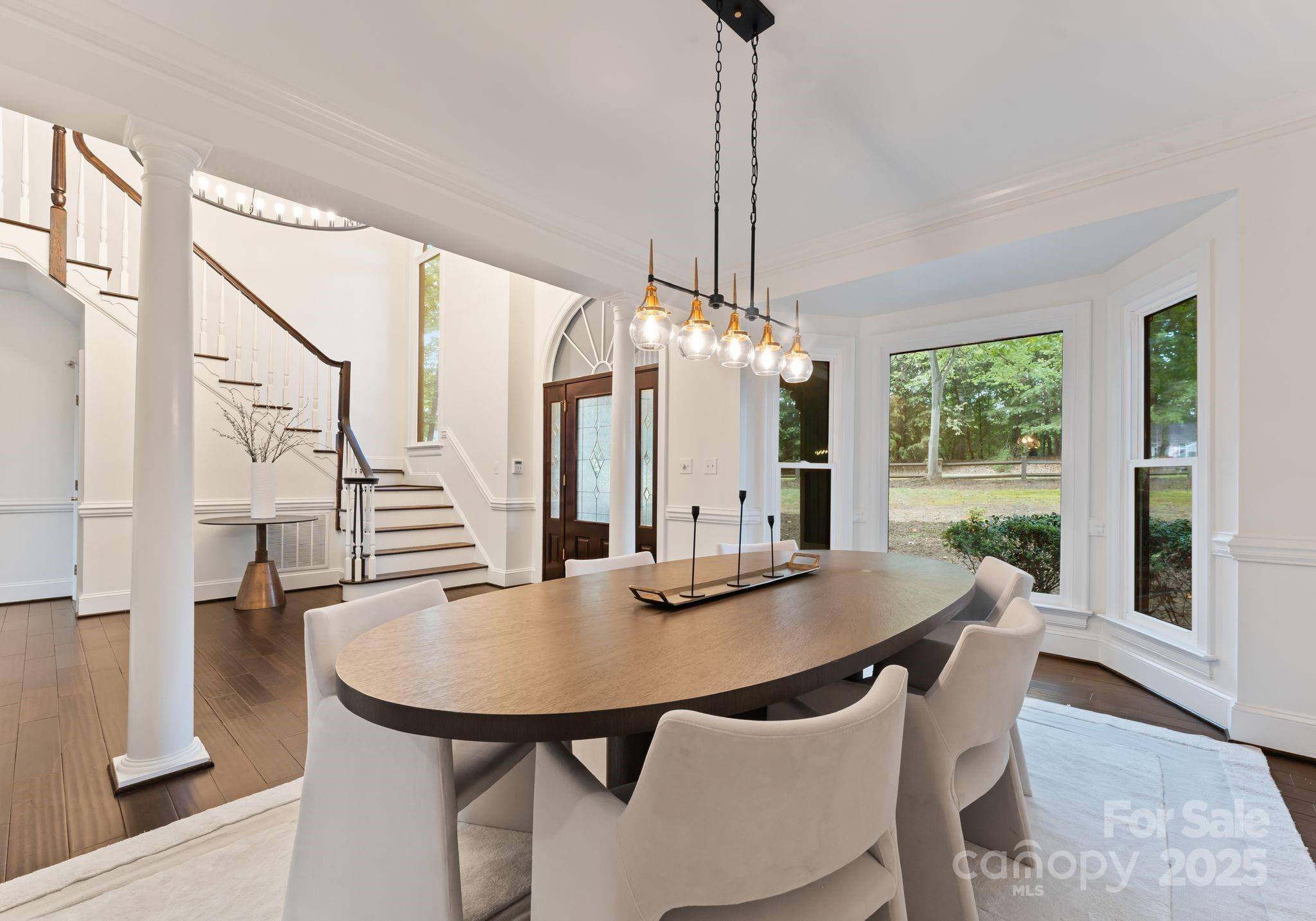 252 Greyfriars Road Mooresville, NC 28117 - Photo 12 of 46 a view of a dining room with furniture window and outside view