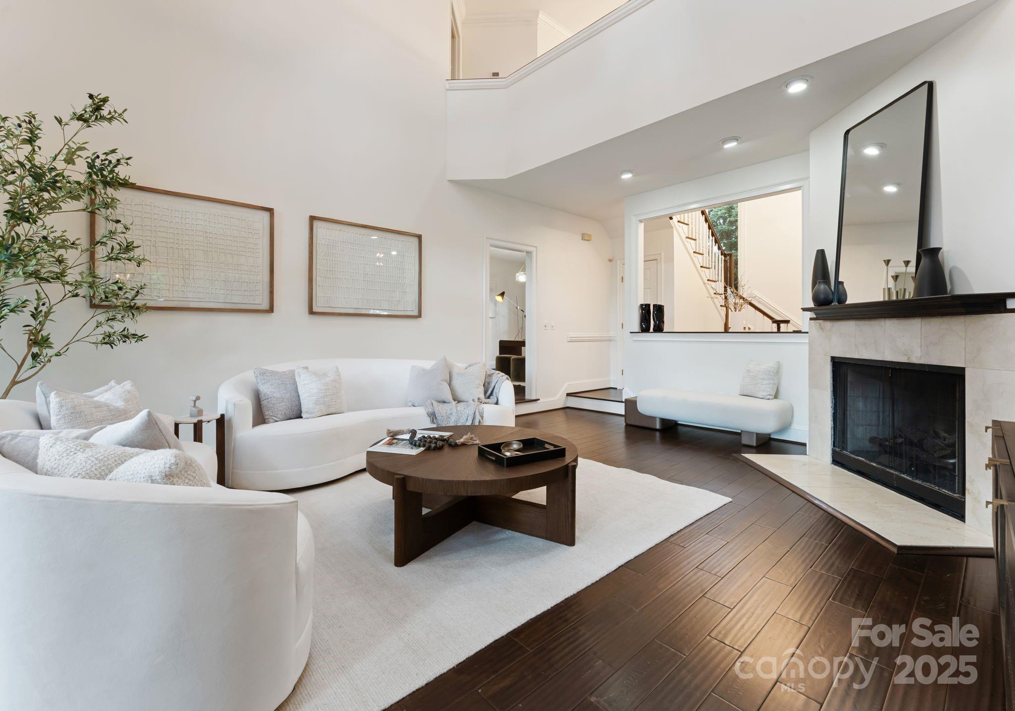 252 Greyfriars Road Mooresville, NC 28117 - Photo 14 of 46 a living room with furniture and a fireplace