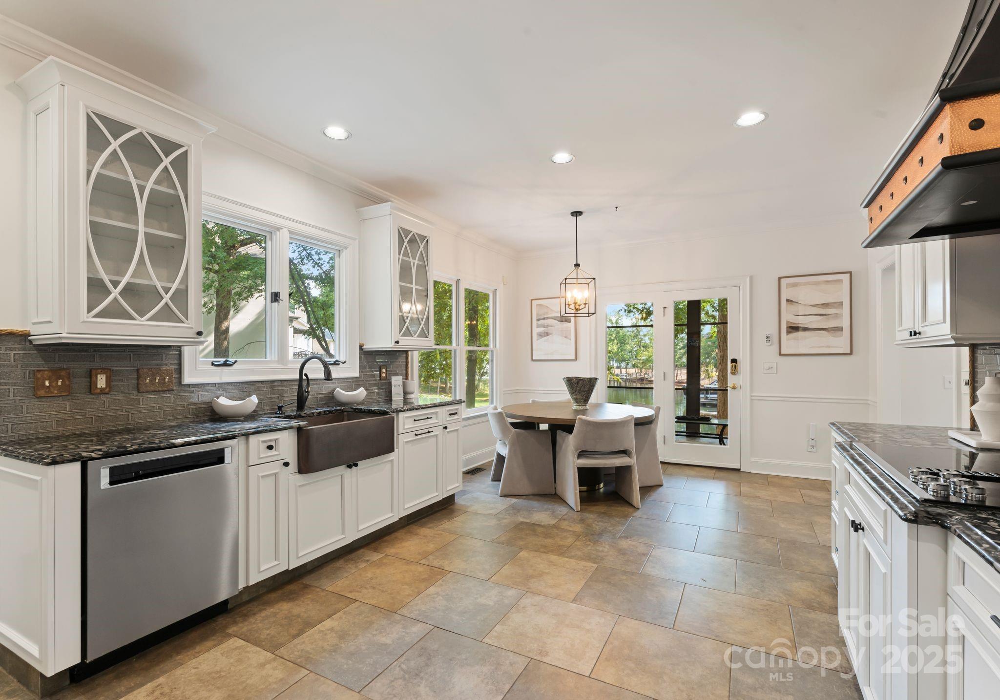 252 Greyfriars Road Mooresville, NC 28117 - Photo 19 of 46 a kitchen with counter top space appliances and windows