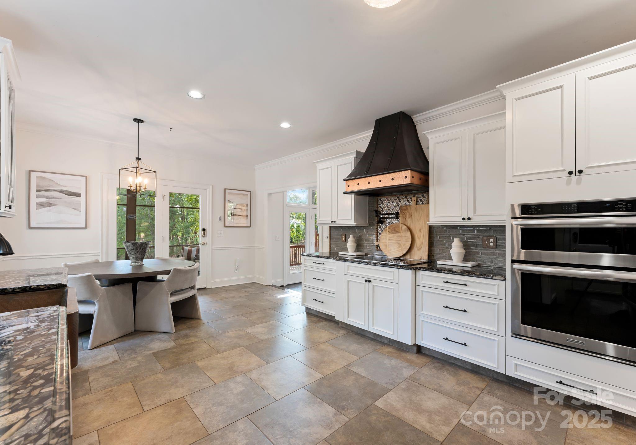 252 Greyfriars Road Mooresville, NC 28117 - Photo 20 of 46 a kitchen with stainless steel appliances granite countertop a stove sink and cabinets