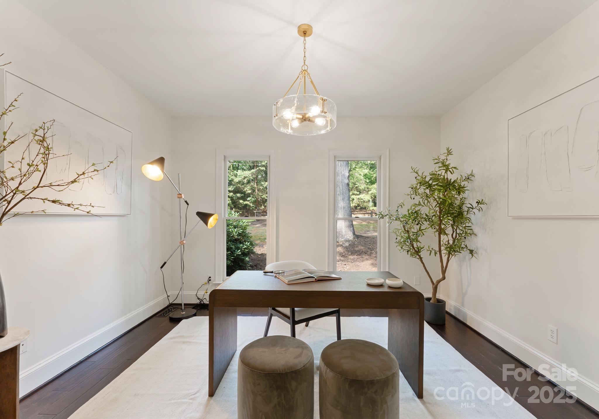 252 Greyfriars Road Mooresville, NC 28117 - Photo 22 of 46 a view of a dining room with furniture and wooden floor