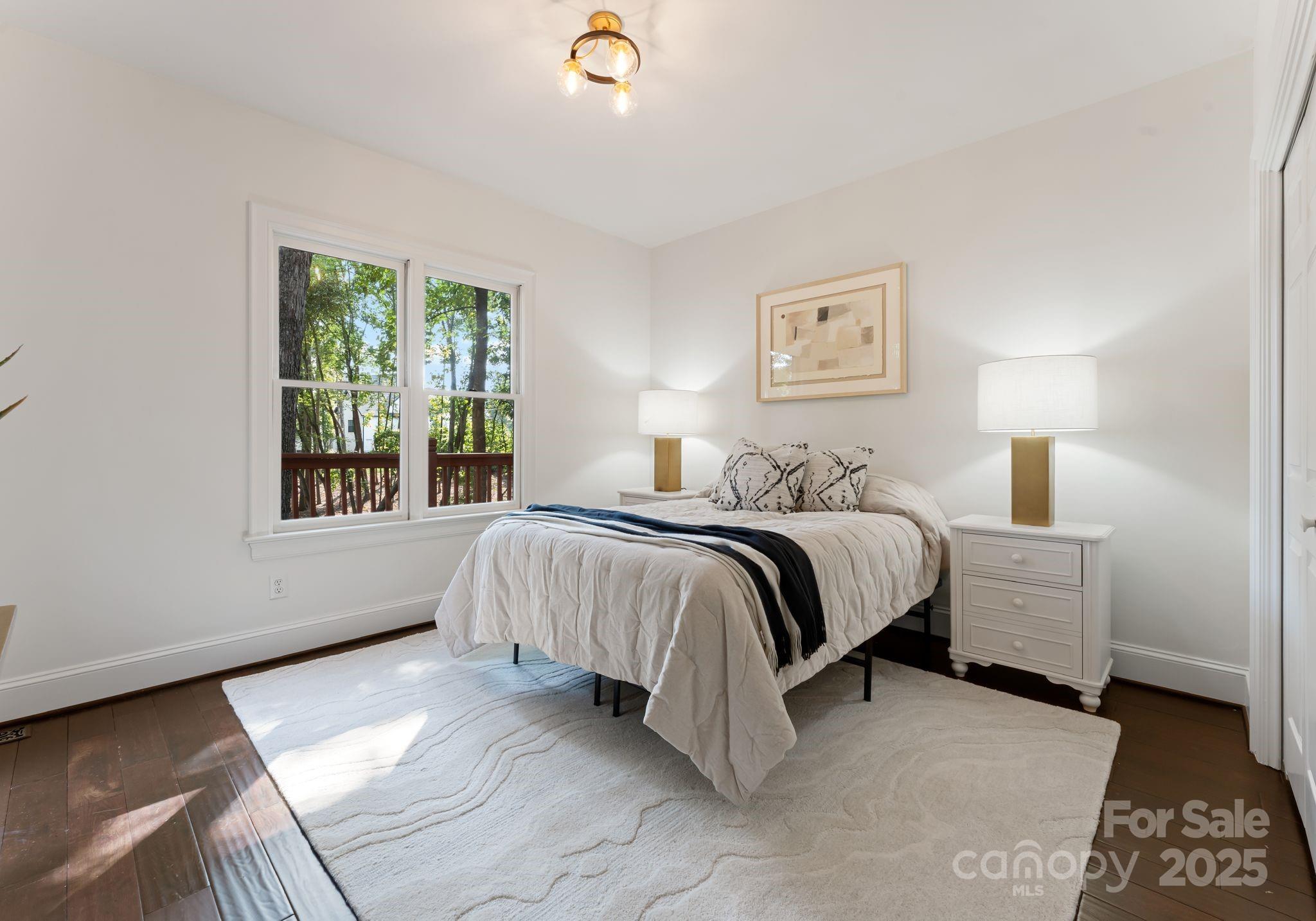 252 Greyfriars Road Mooresville, NC 28117 - Photo 24 of 46 a spacious bedroom with a bed and a window