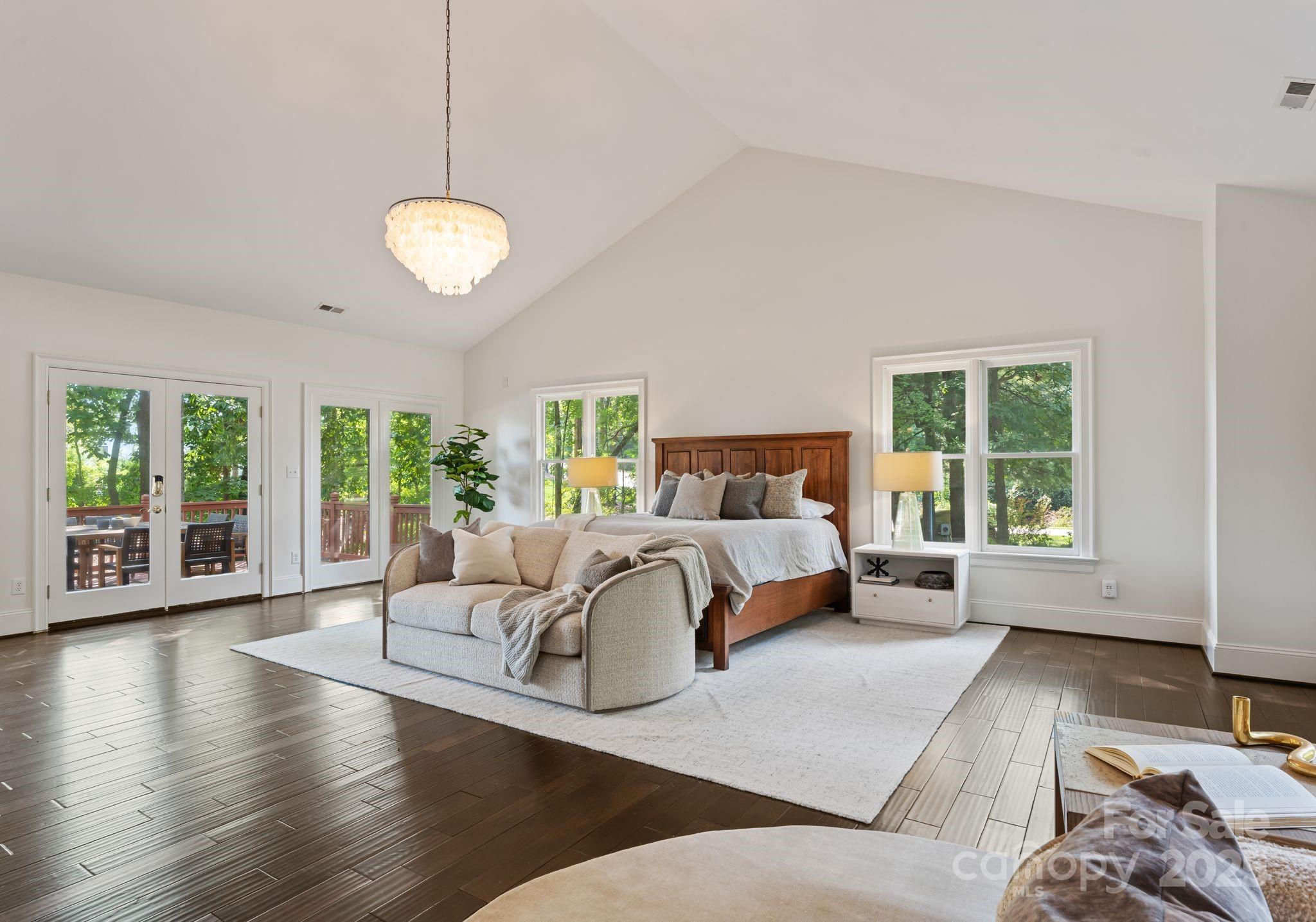 252 Greyfriars Road Mooresville, NC 28117 - Photo 26 of 46 a bedroom with a large bed and a large window