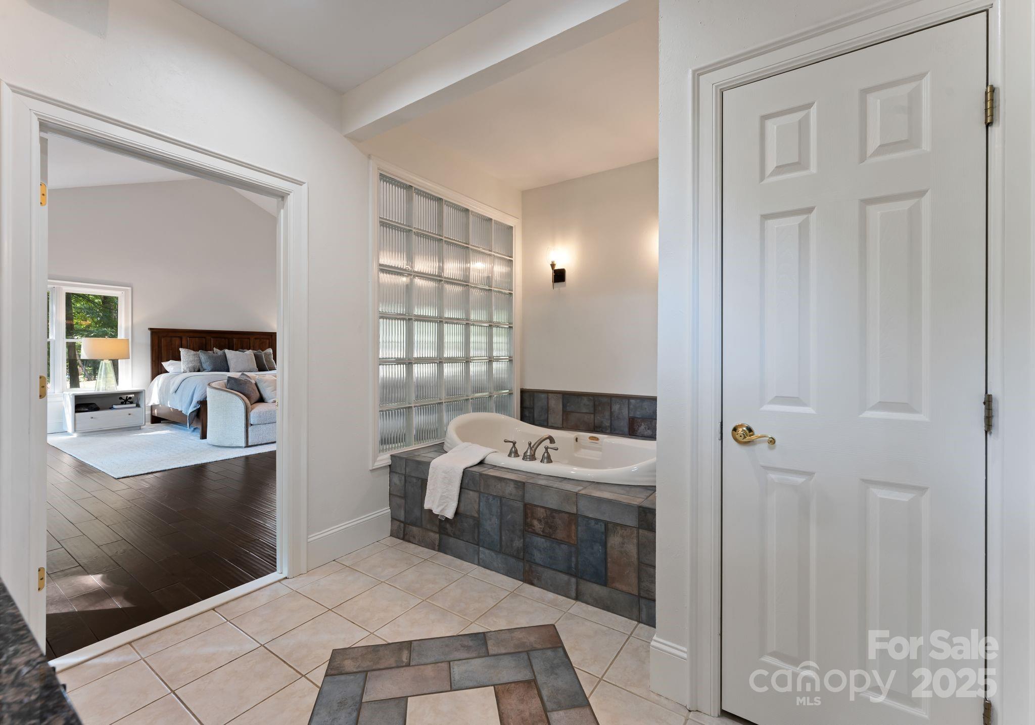 252 Greyfriars Road Mooresville, NC 28117 - Photo 29 of 46 a room that has a bed and a table in it