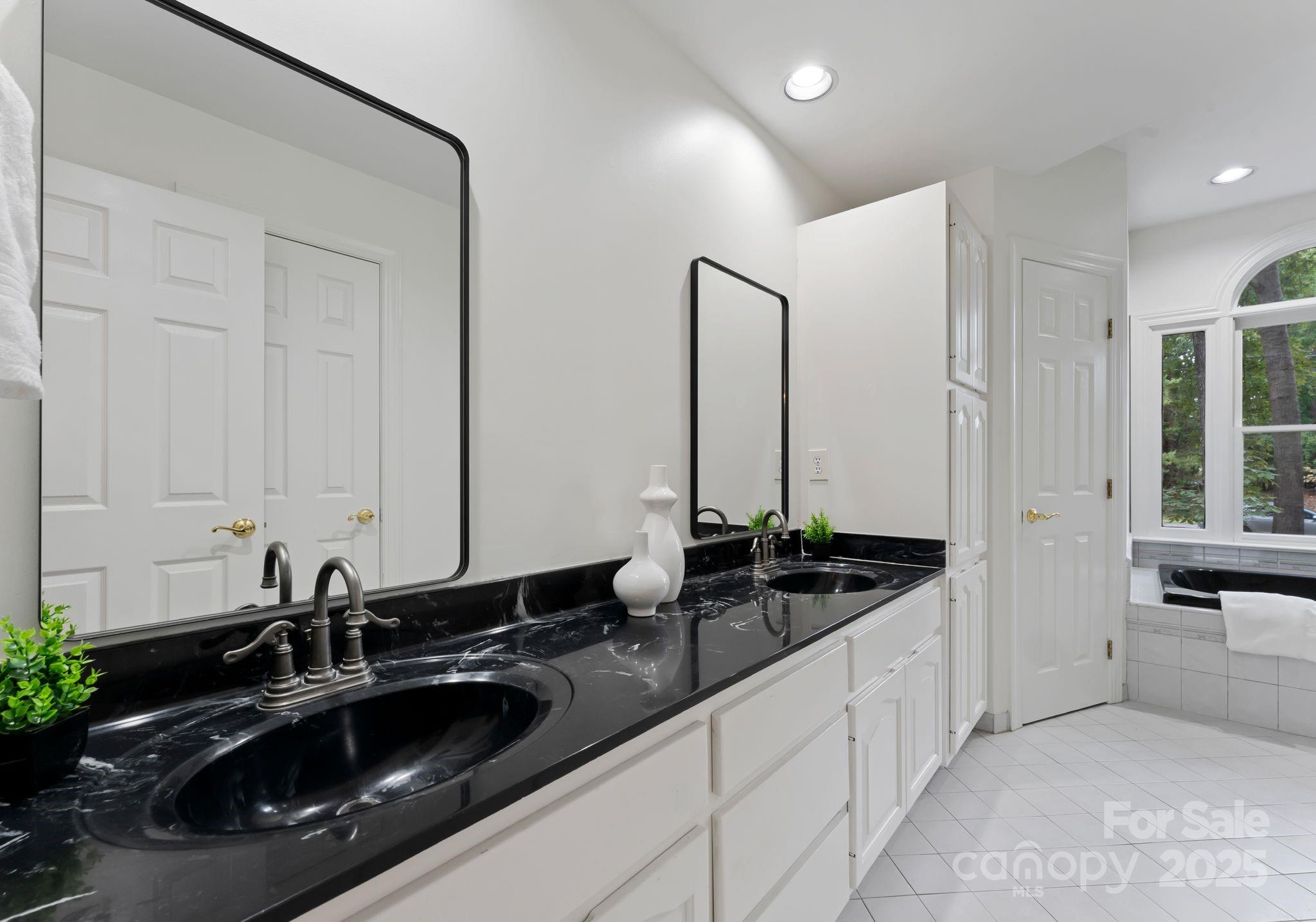 252 Greyfriars Road Mooresville, NC 28117 - Photo 38 of 46 a kitchen with a sink and cabinets