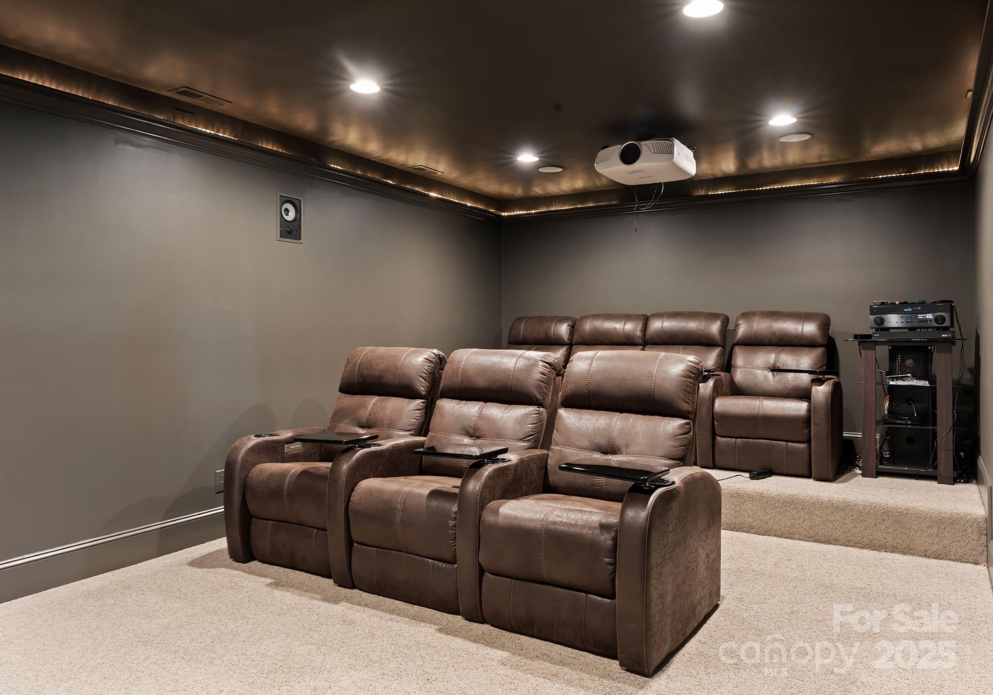 252 Greyfriars Road Mooresville, NC 28117 - Photo 42 of 46 a media room with lots of chairs and a projector