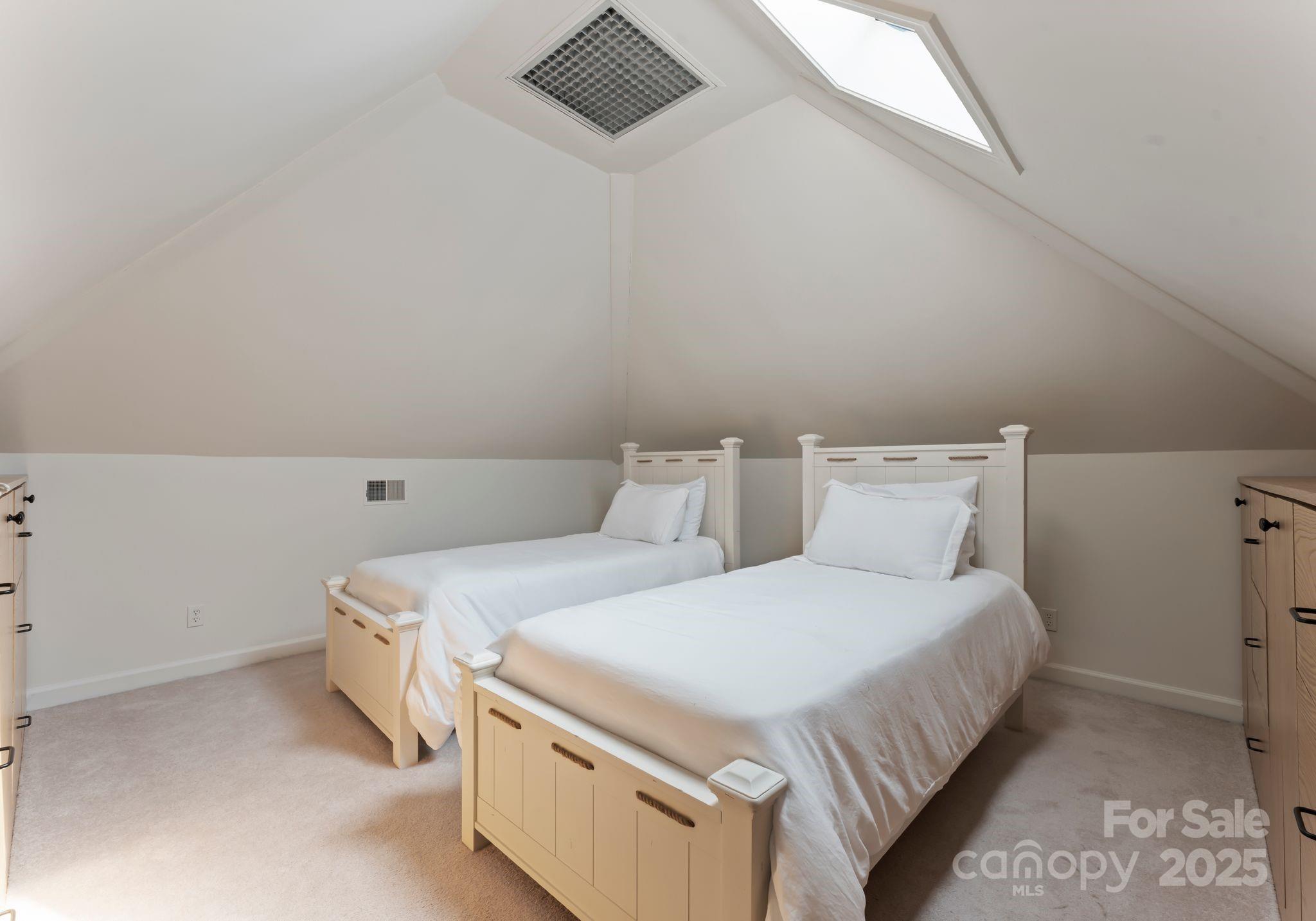 252 Greyfriars Road Mooresville, NC 28117 - Photo 43 of 46 a bedroom with a bed and two lamp