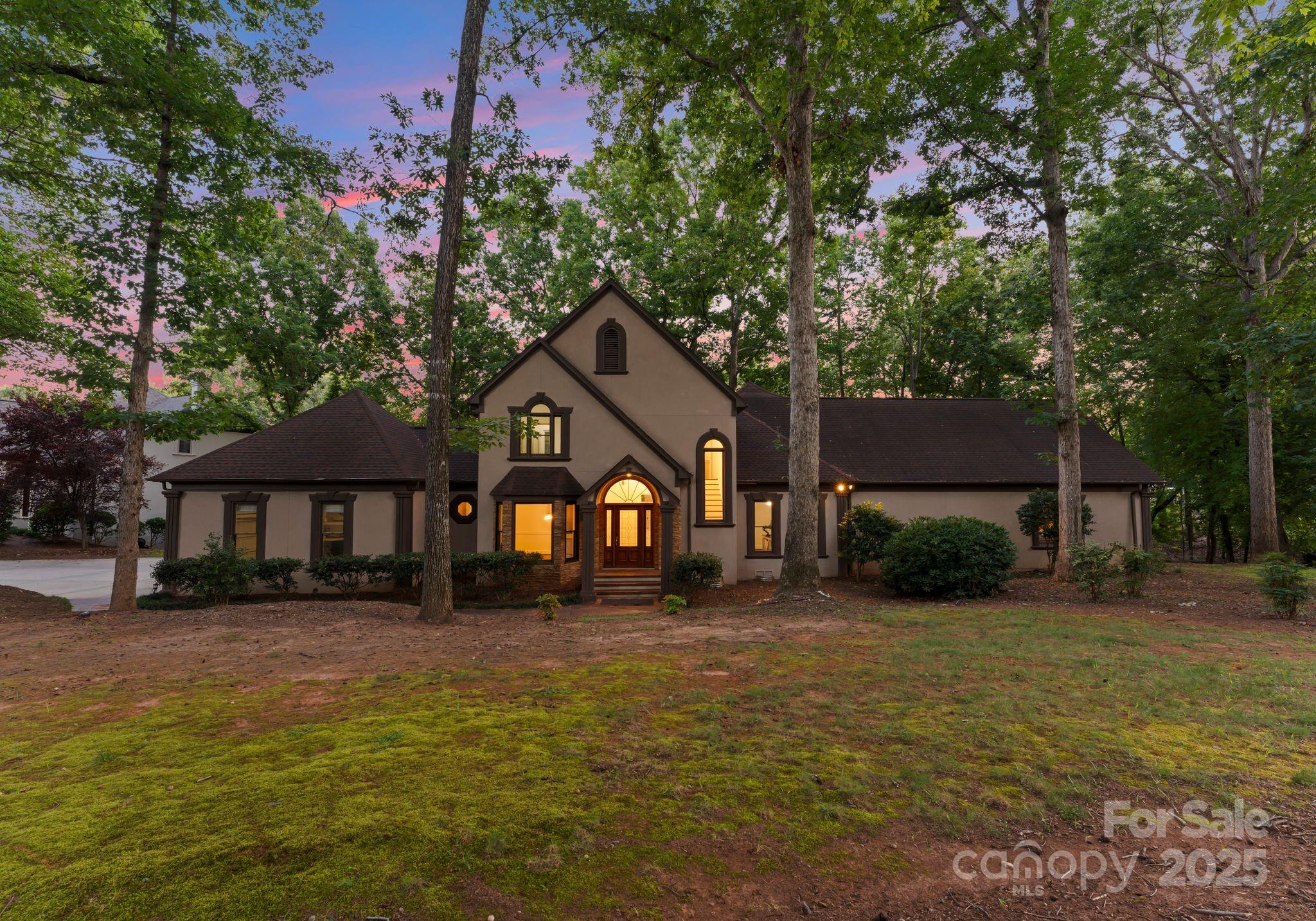 252 Greyfriars Road Mooresville, NC 28117 - Photo 44 of 46 a front view of a house with a yard and garage
