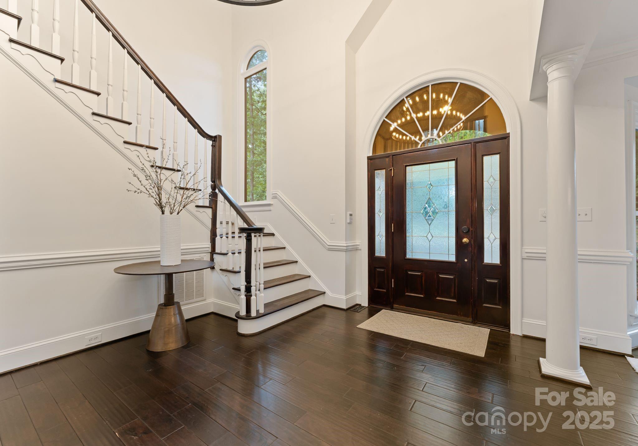 252 Greyfriars Road Mooresville, NC 28117 - Photo 6 of 46 a view of entryway and hall with wooden floor