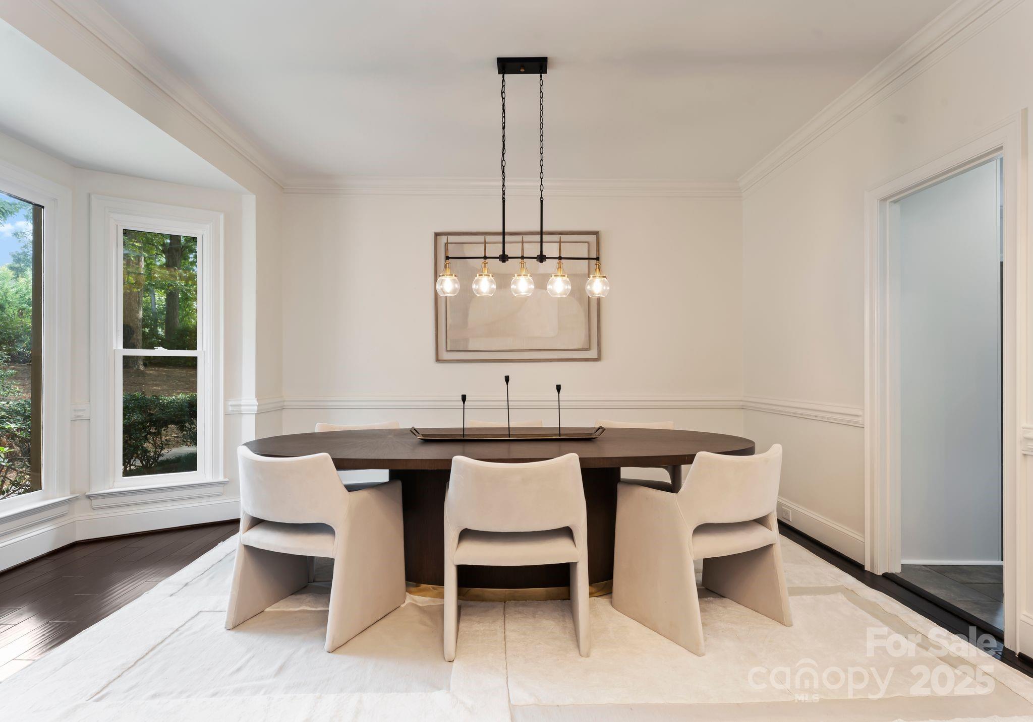 252 Greyfriars Road Mooresville, NC 28117 - Photo 10 of 46 a view of a dining room with furniture window and wooden floor