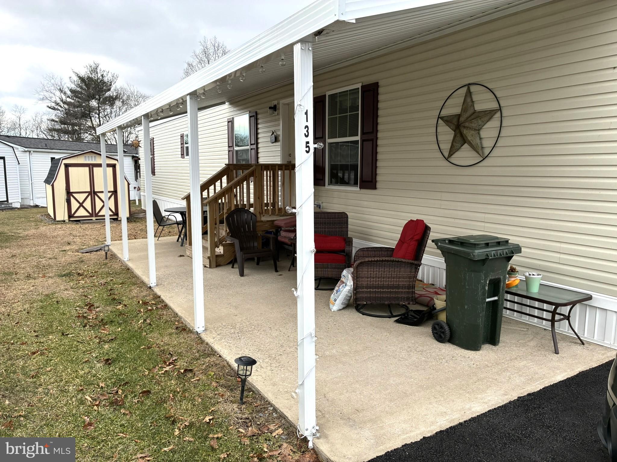 135 Hillside Lane Howard, PA 16841 - Photo 16 of 19 a backyard of a house with barbeque oven and furniture