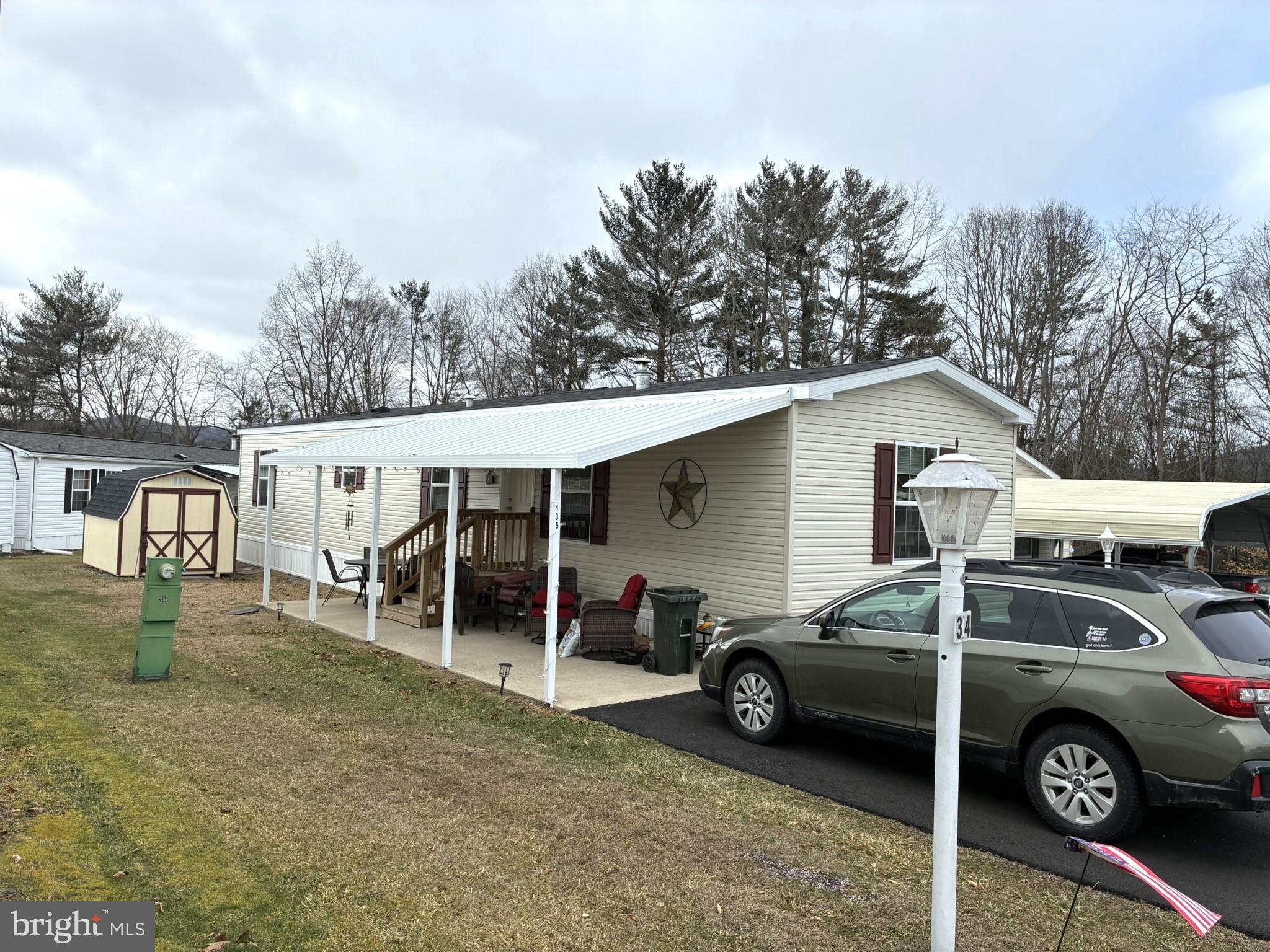 135 Hillside Lane Howard, PA 16841 - Photo 19 of 19 a car parked in front of a house