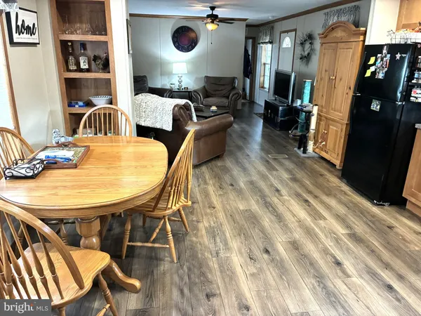 a bedroom with furniture and a wooden floor