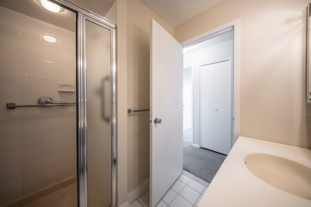 1002 Paradise Road, Unit PHE Swampscott, MA 01907 - Photo 13 of 23 a bathroom with a tub and shower