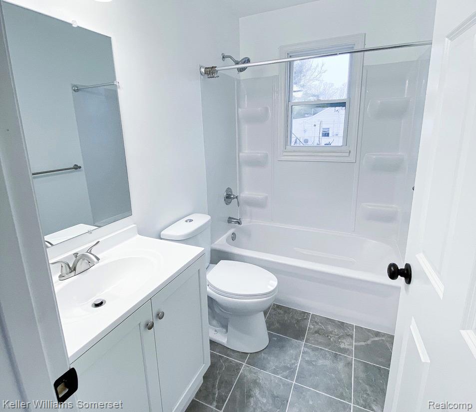 1821 Nazareth Road Kalamazoo, MI 49048 - Photo 11 of 20 Bathroom featuring a white vanity with integrated sink, chrome fixtures, and a frameless mirror