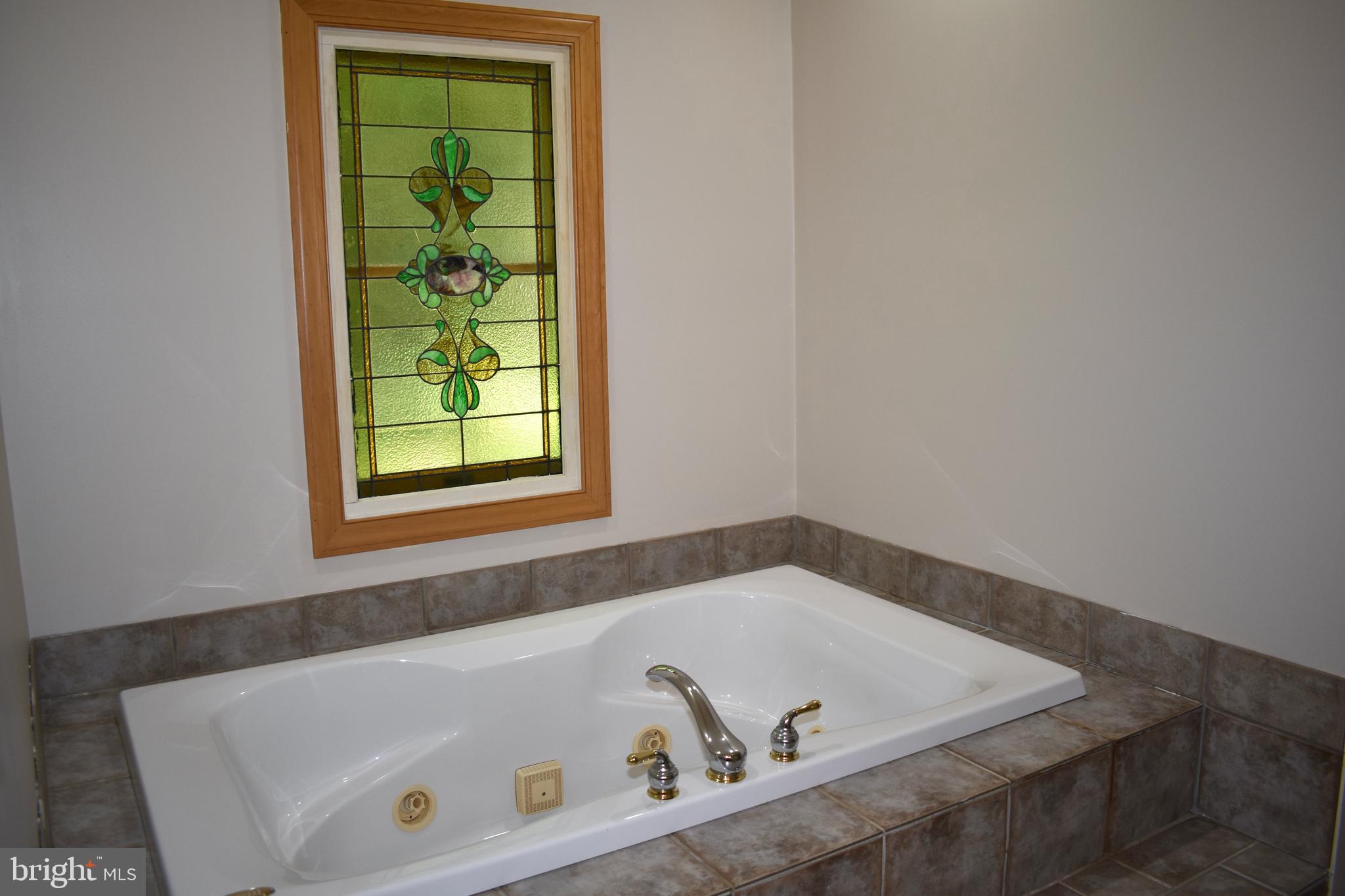 15745 Baden Naylor Road Brandywine, MD 20613 - Photo 17 of 59 Jetted tub with stained glass window