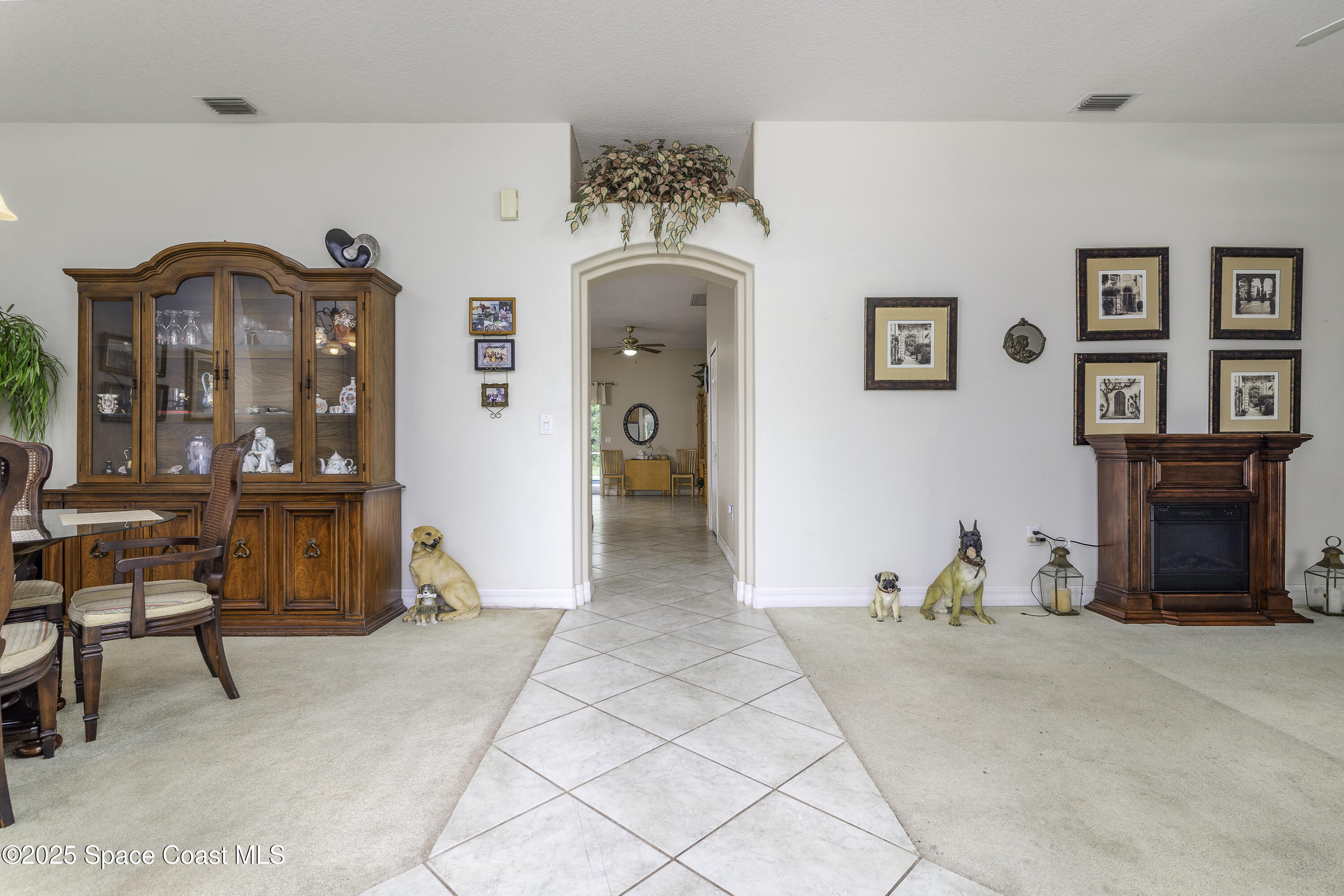 386 Northwest Valencia Road Melbourne, FL 32904 - Photo 23 of 50 Dining & Living Rooms Bookend Foyer