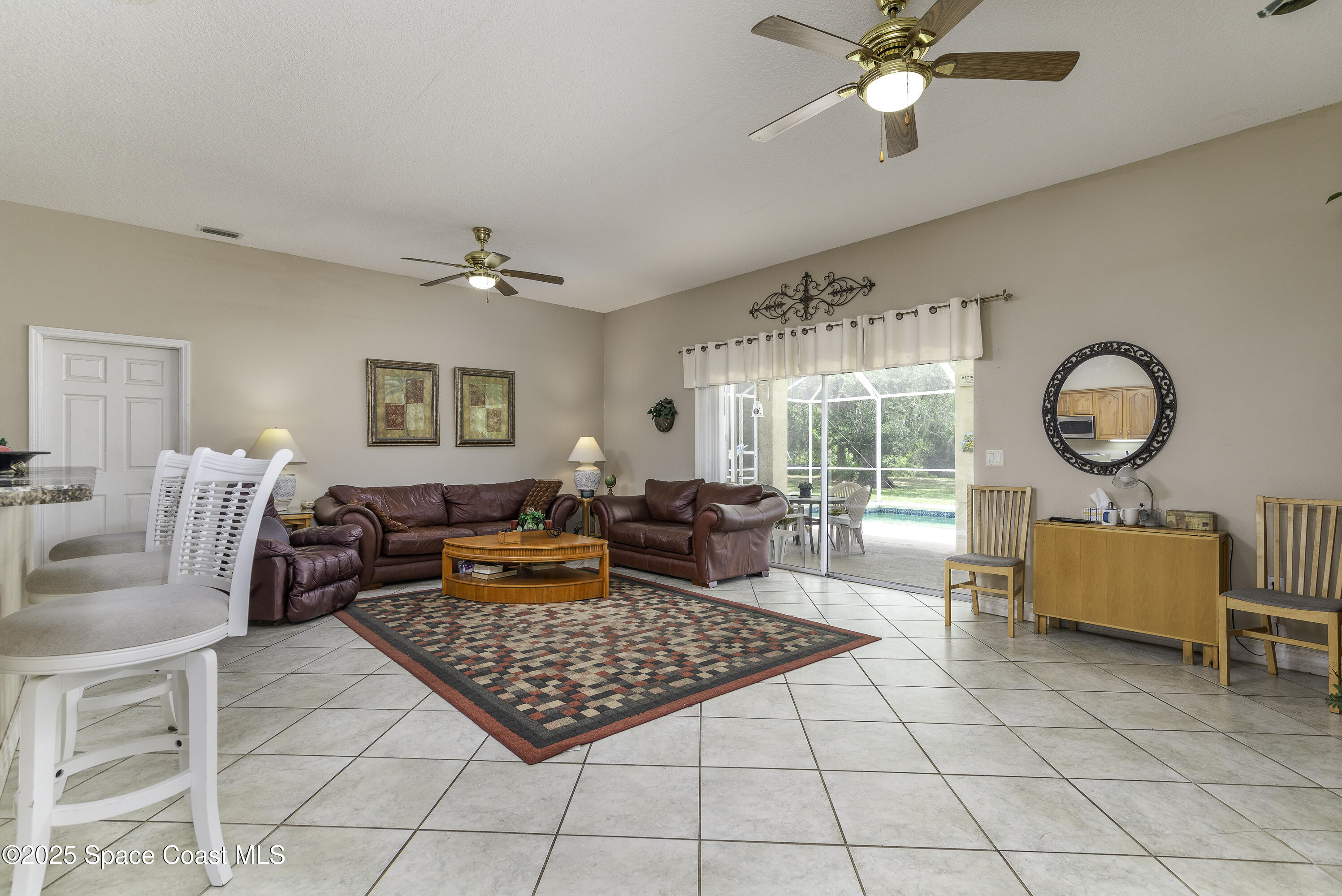 386 Northwest Valencia Road Melbourne, FL 32904 - Photo 32 of 50 Sliders Connect You To The Outdoors