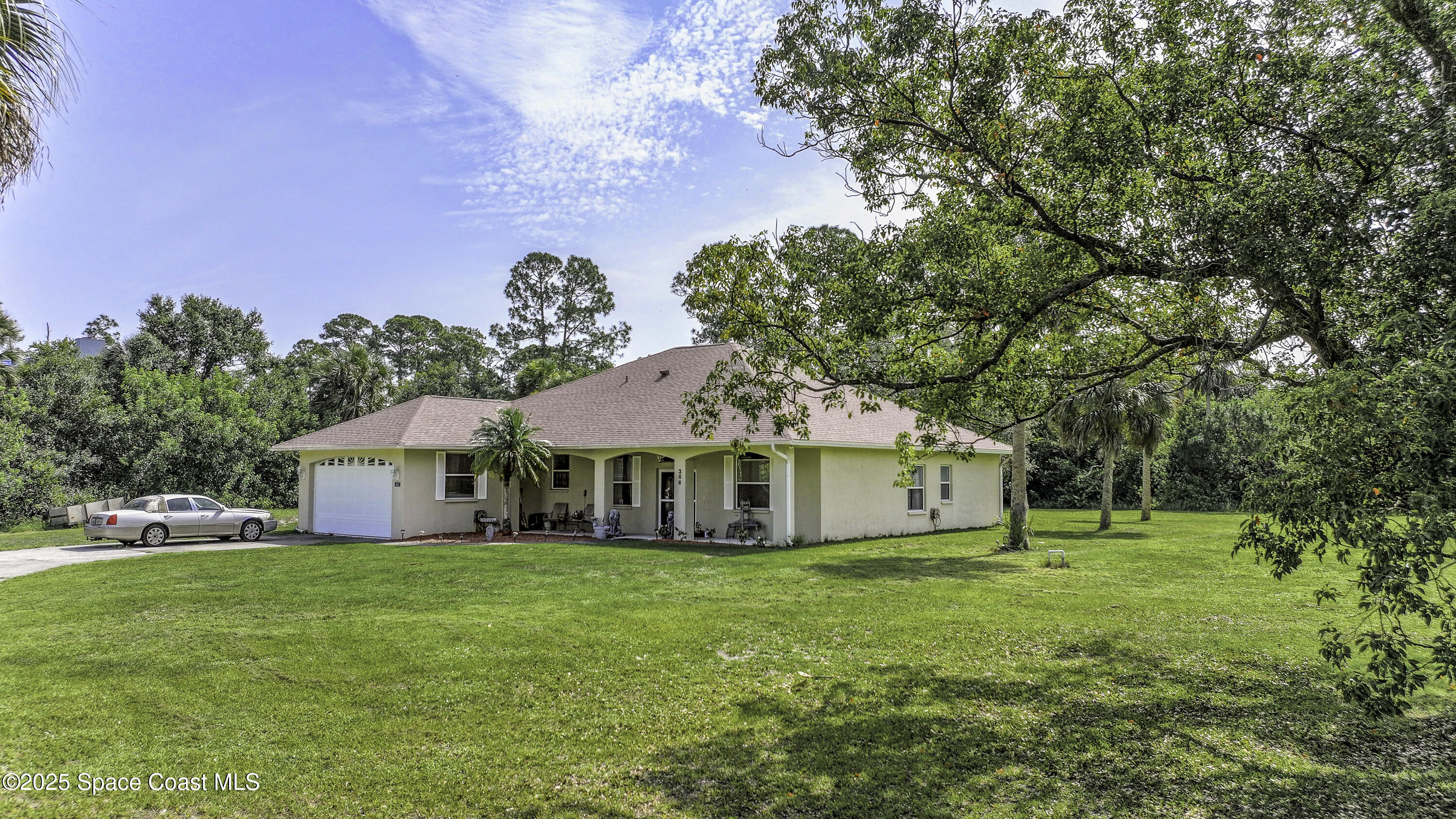 386 Northwest Valencia Road Melbourne, FL 32904 - Photo 4 of 50 Roof Replacement 2024