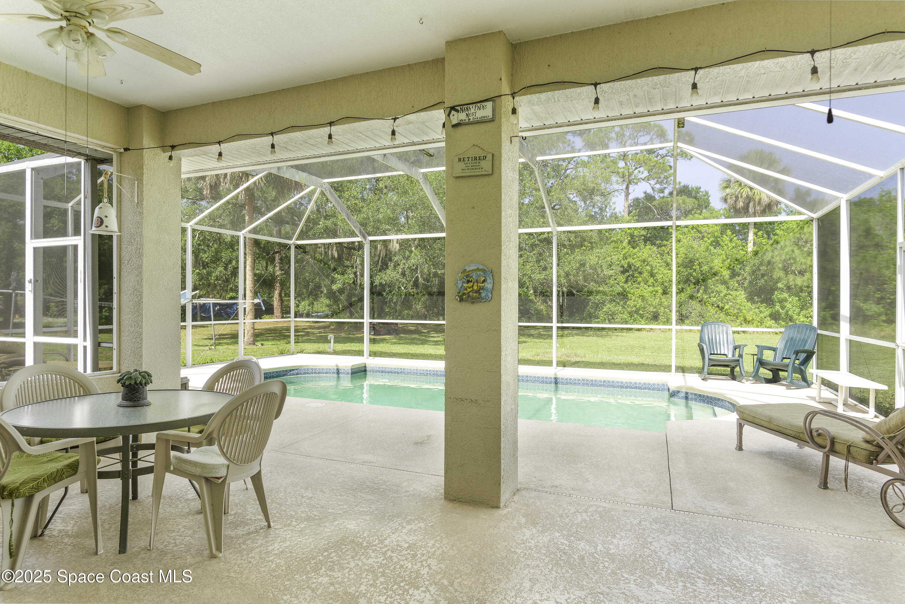386 Northwest Valencia Road Melbourne, FL 32904 - Photo 44 of 50 Relax In The Shade Of The Trussed Patio