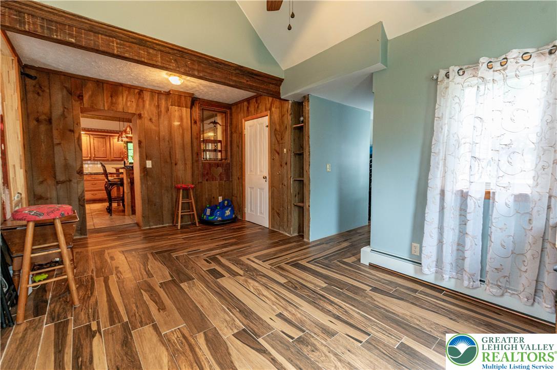 2485 Hieter Road Quakertown, PA 18951 - Photo 7 of 97 Herringbone patterned hardwood flooring creates a distinctive visual foundation in this inviting living area.
