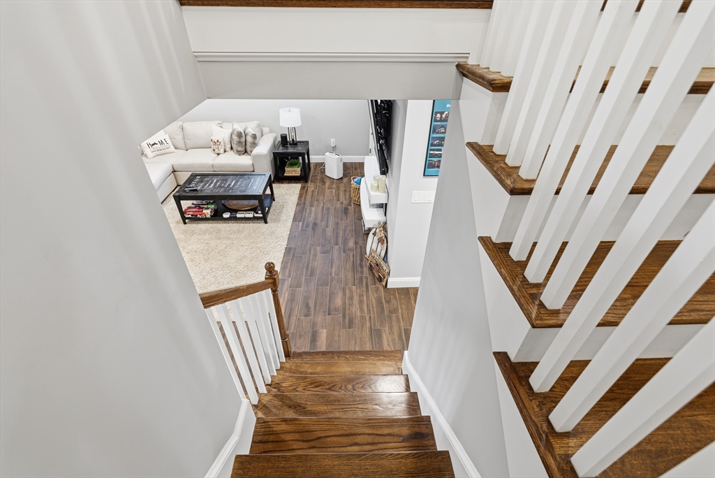 491 Washington Street, Unit 1 Braintree, MA 02184 - Photo 28 of 42 a view of stairs and furniture