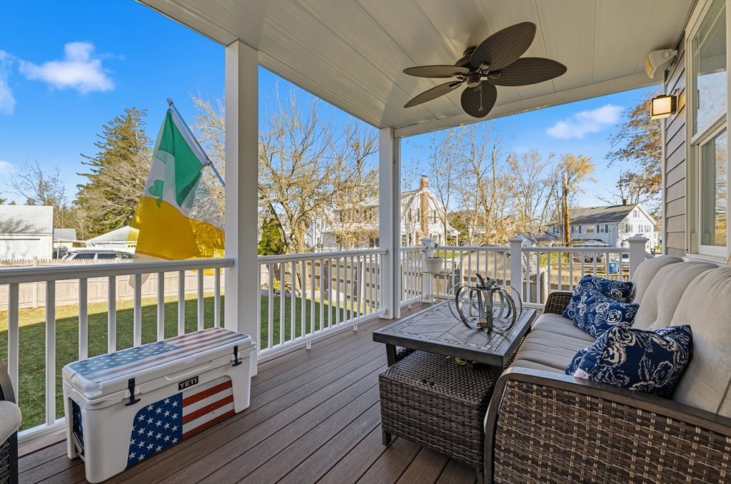 491 Washington Street, Unit 1 Braintree, MA 02184 - Photo 37 of 42 a view of a balcony with furniture and wooden floor