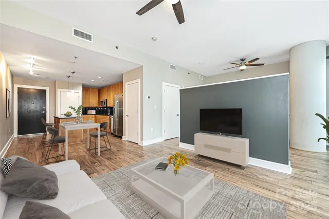 a living room with furniture and a flat screen tv