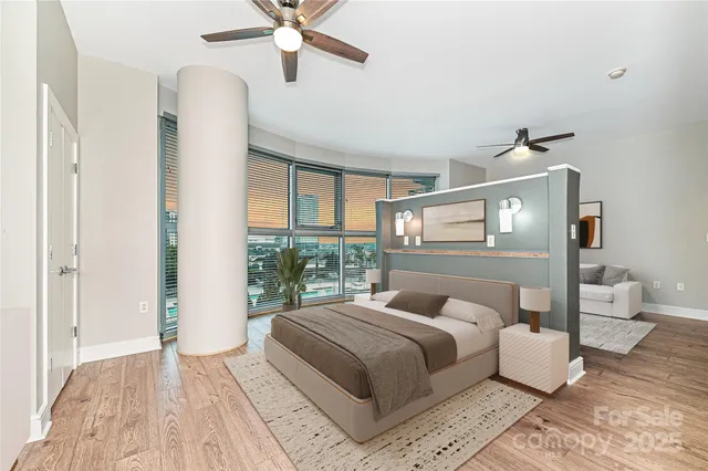 a bedroom with a large bed and a window