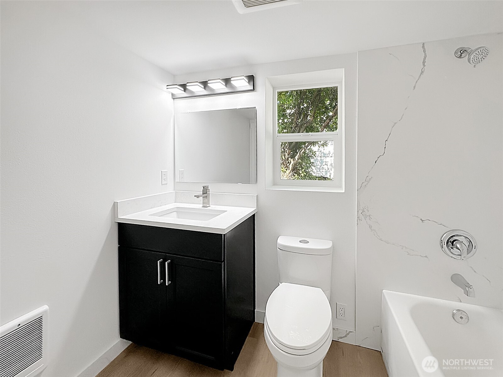 7403 Beverly Boulevard Everett, WA 98203 - Photo 9 of 19 a bathroom with a sink toilet and vanity
