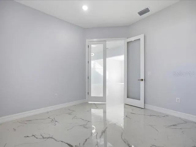 a view of an empty room and window