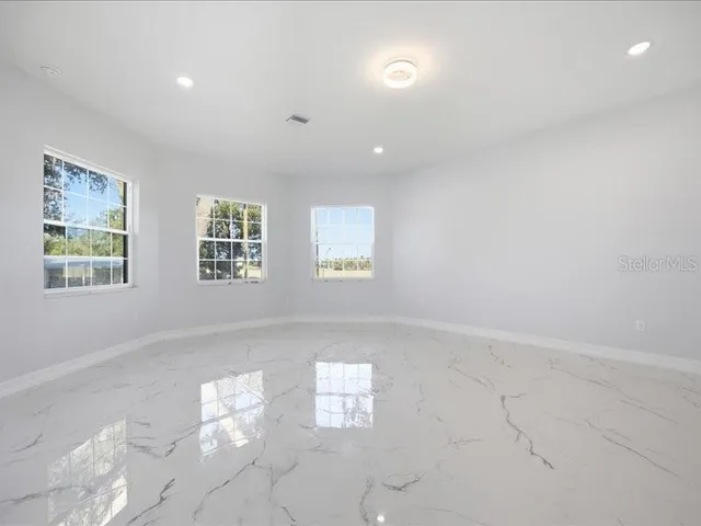 an empty room with windows