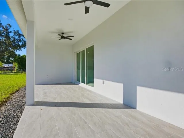 a view of an house with backyard space and garden