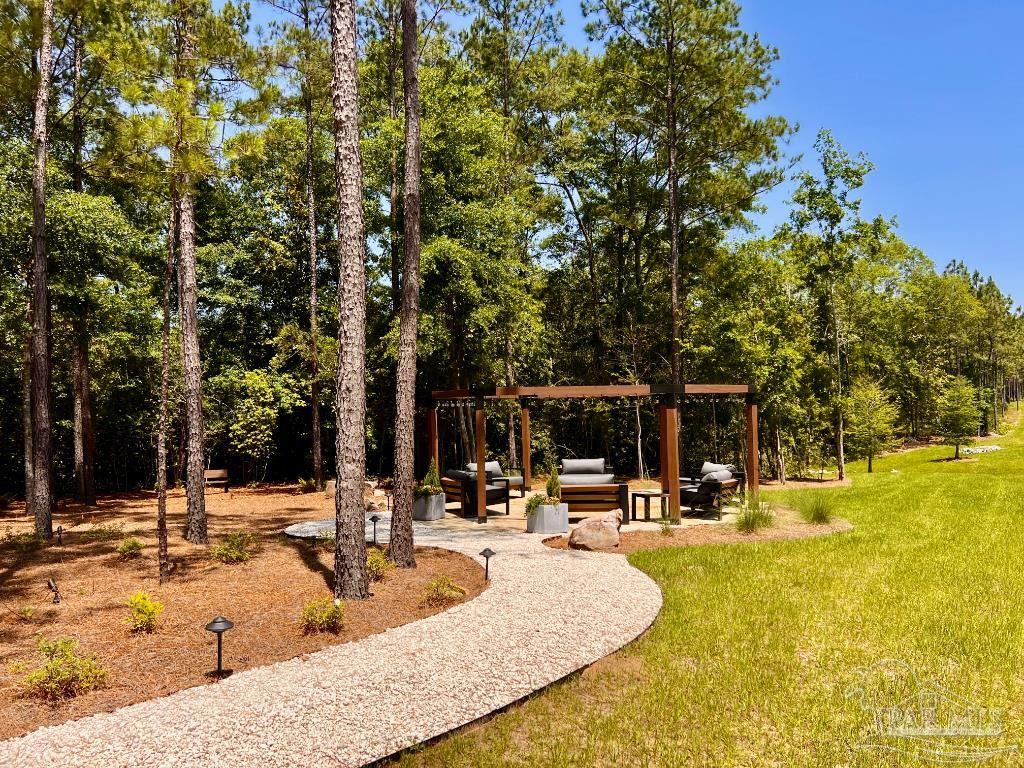 Lot 16 Naturewalk Drive Milton, FL 32571 - Photo 18 of 35 a view of a swimming pool with an outdoor seating