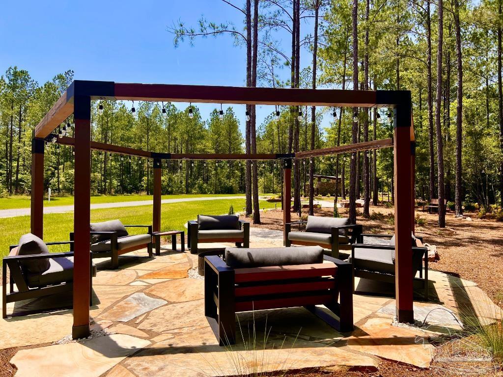 Lot 16 Naturewalk Drive Milton, FL 32571 - Photo 20 of 35 a living room with furniture and a floor to ceiling window